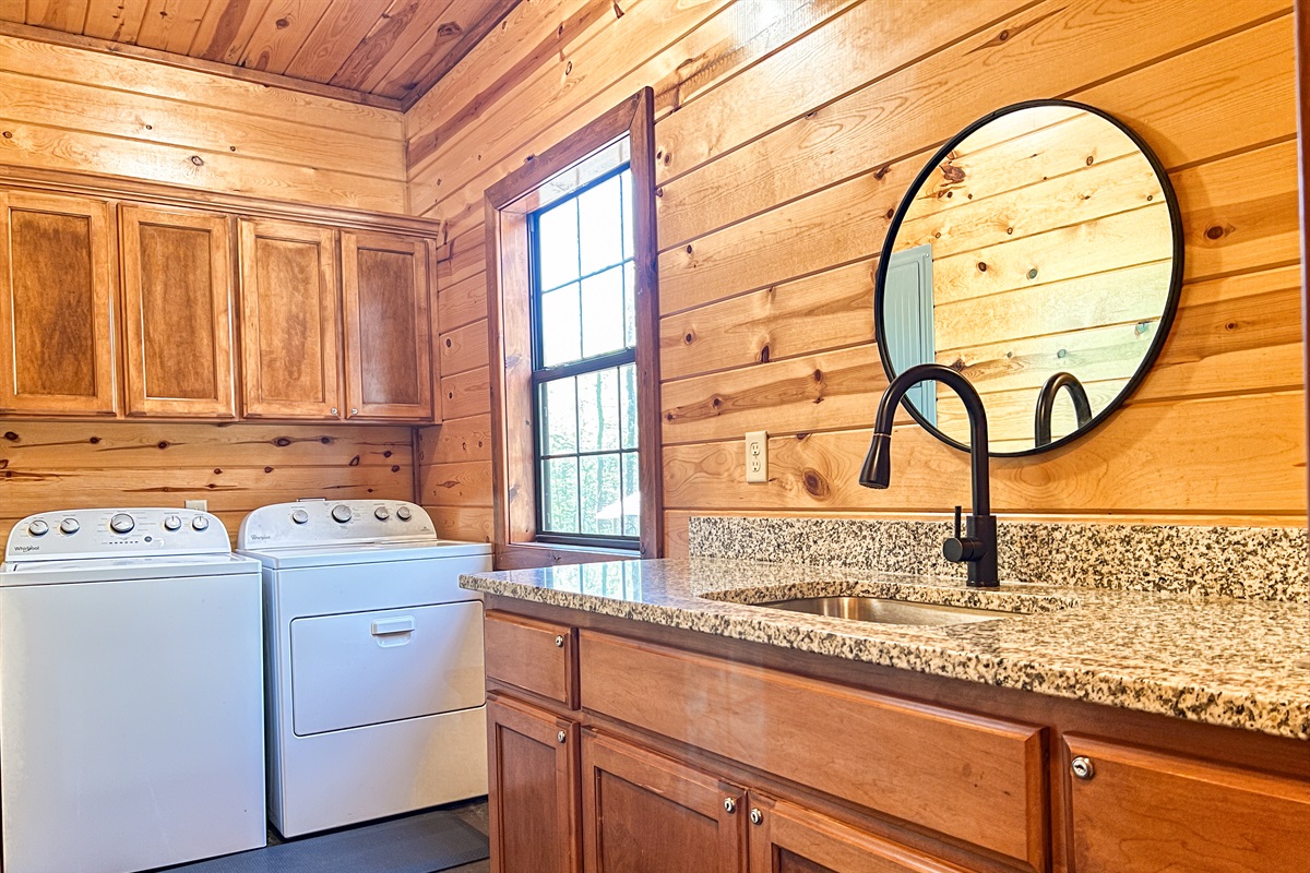 Laundry room located off the kitchen with second sink.