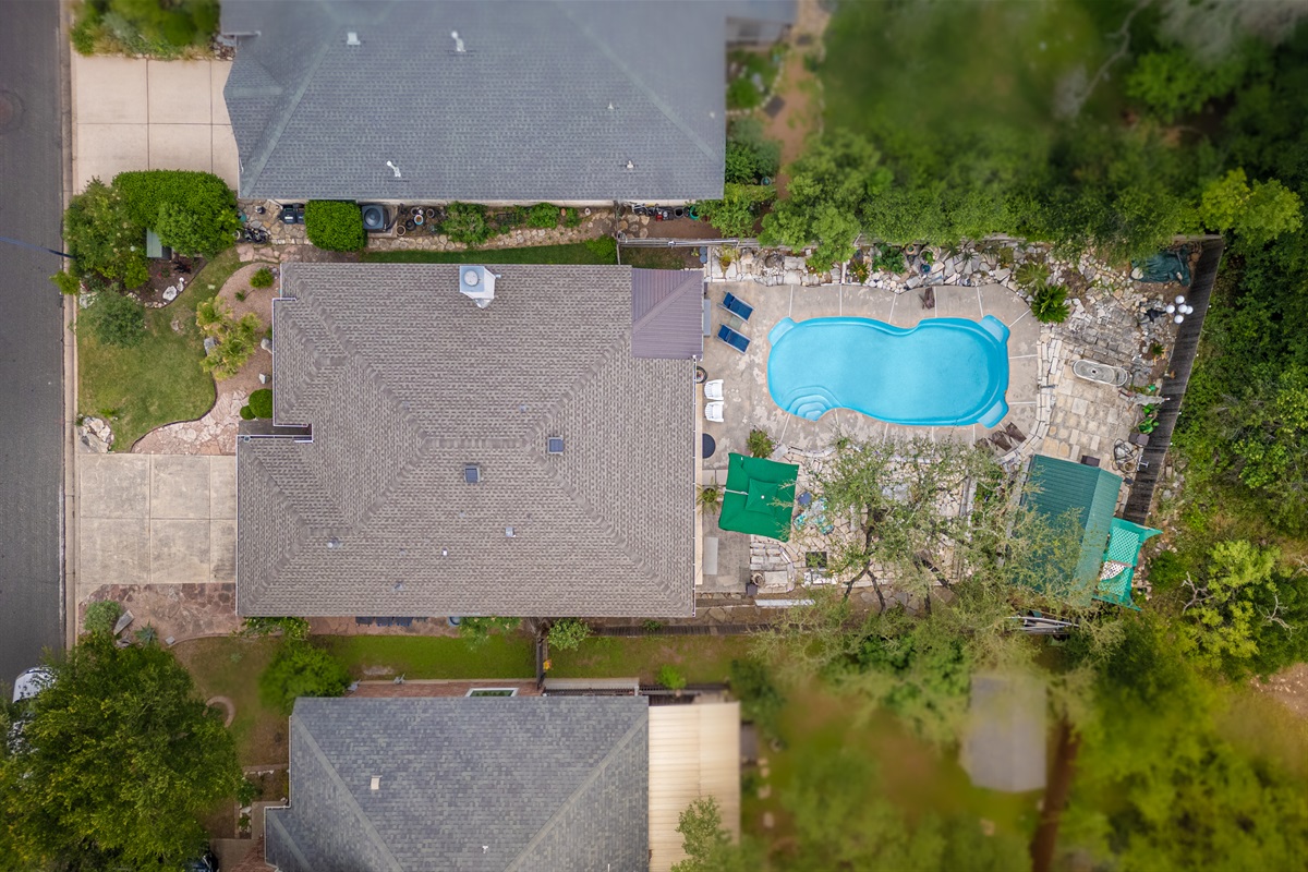 Welcome to your own private Backyard Oasis. Spa jets in pool bench seats & separate hot tub. Natural gas grill, oversized hammock for two, heated pool. Could it get any better?! Come, dive in ️