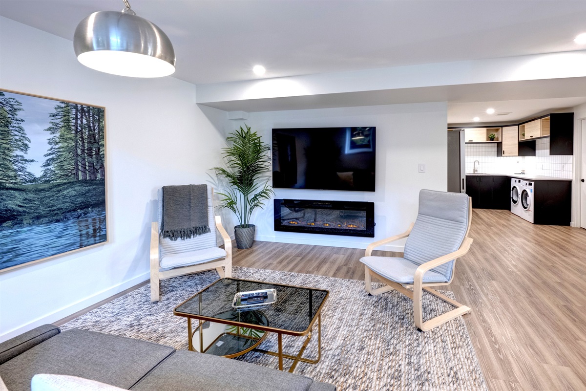 Living room view looking toward the kitchen and dining area.