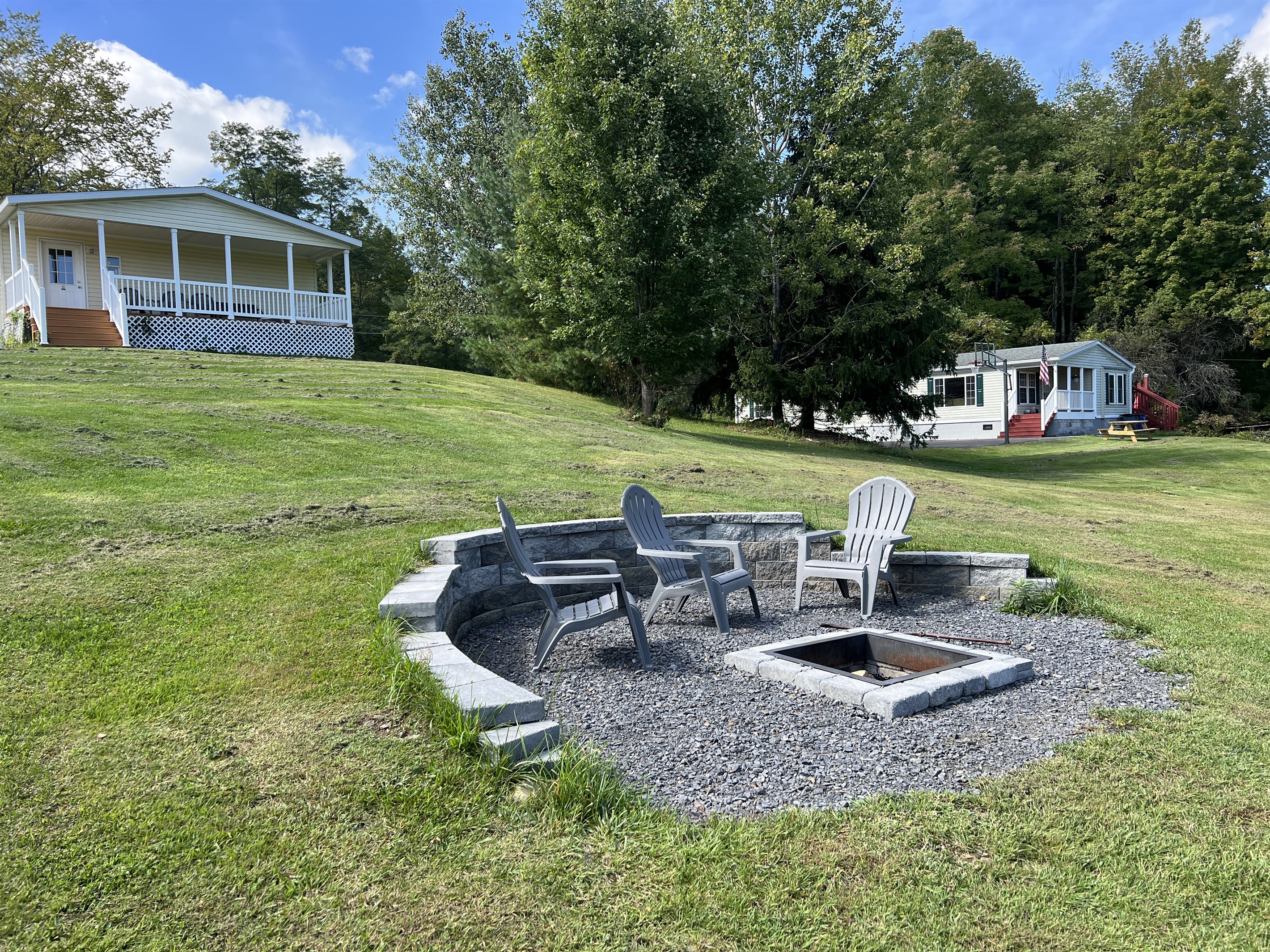 At Home Base lll fire pit. At Home Base ll visible in the background to the right.