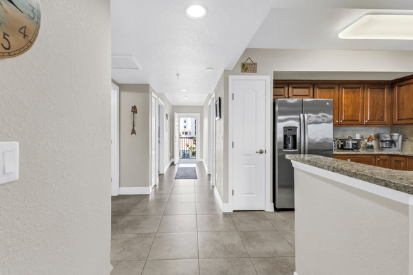 View from living area toward entrance door overlooking pool.