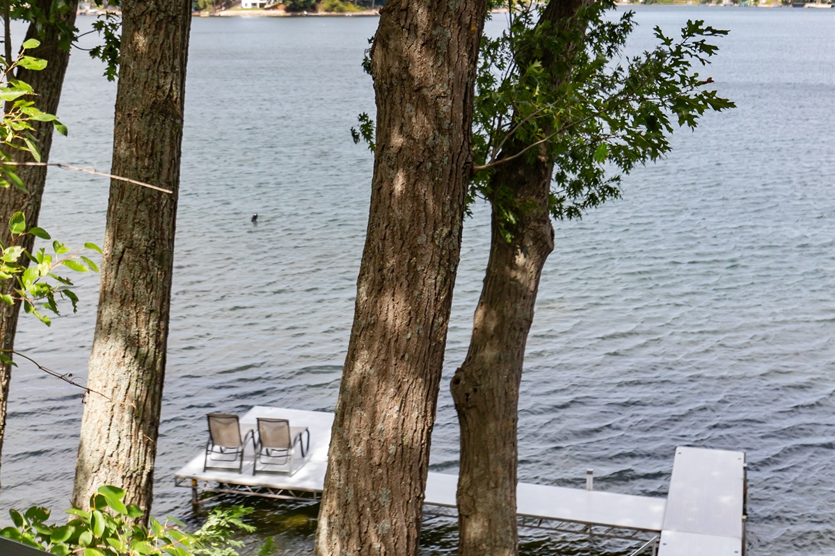 Relax on the deck while watching your family paddle by on kayaks—fun on the water with a view from above.