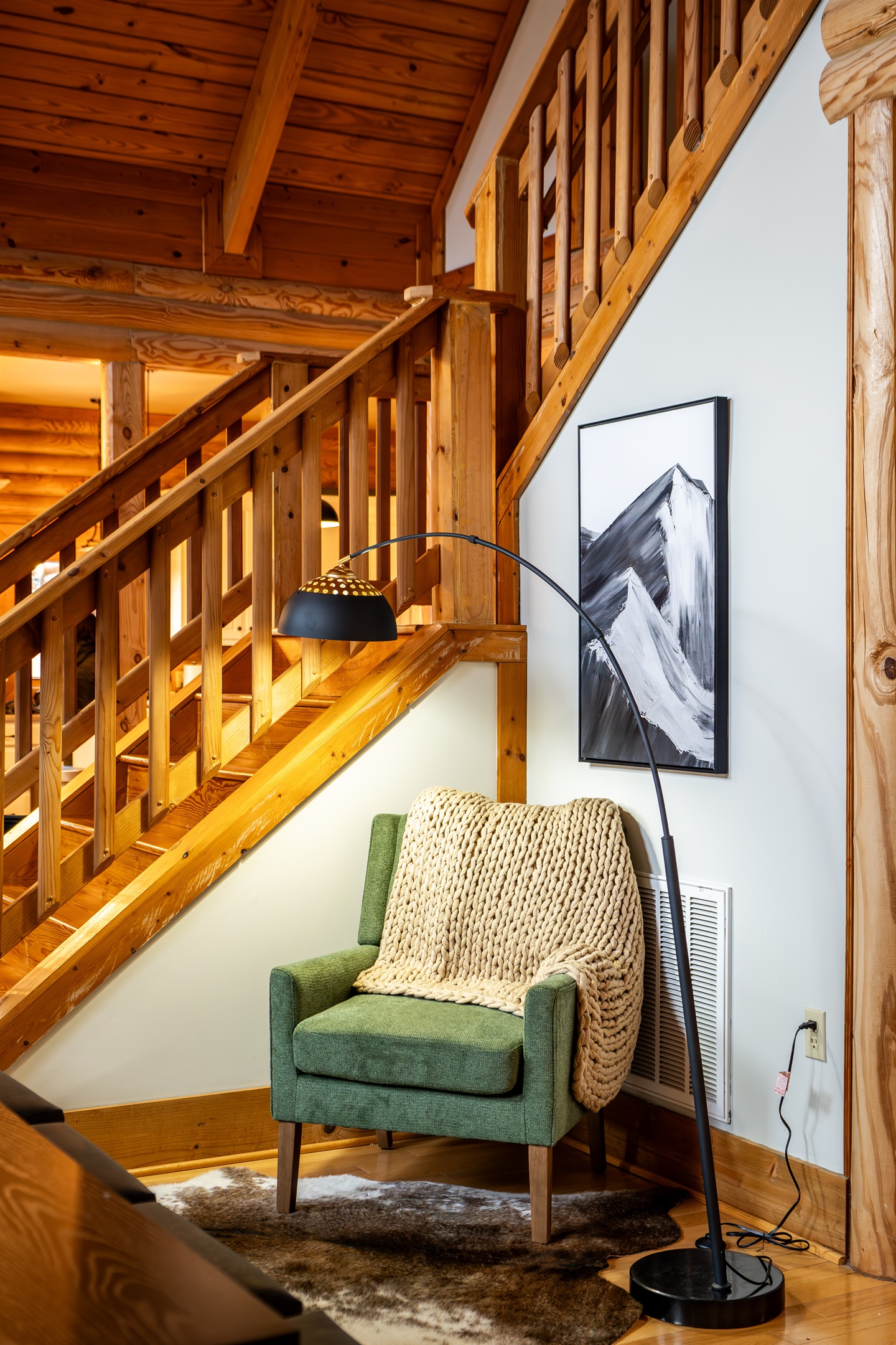 Cozy reading nook tucked under the stairs.