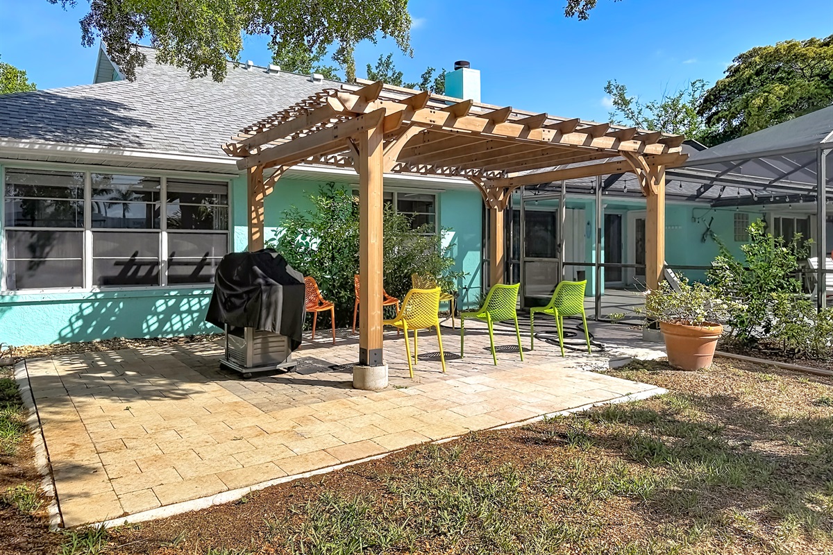 A spacious patio with a BBQ grill, for outdoor family feasts.