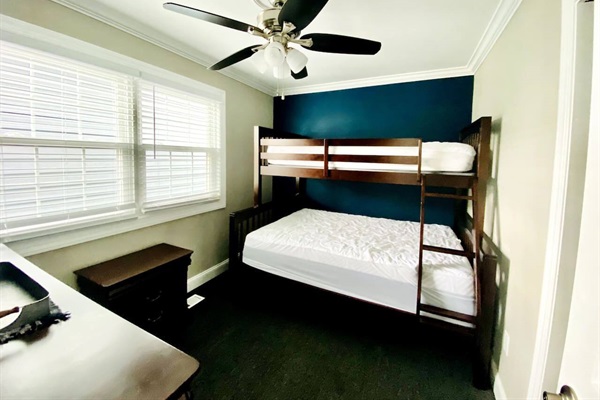 First floor bedroom with Full and twin bunk beds.