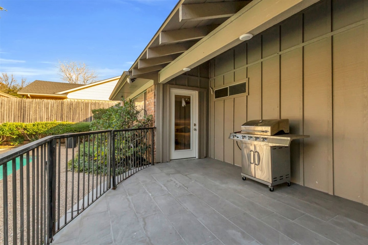 Gas BBQ grill with provided grilling utensils, making it easy to prepare outdoor meals and enjoy relaxed backyard dining.