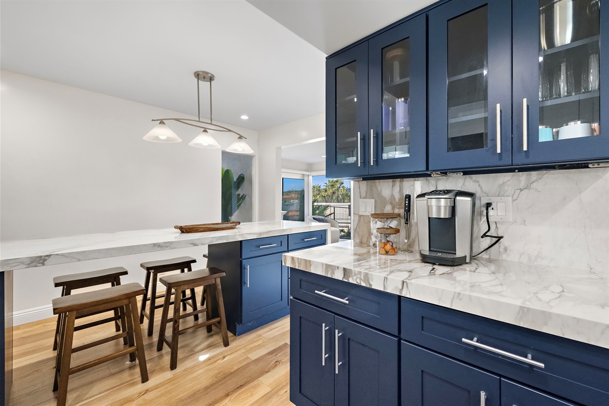 A dedicated coffee and beverage station adds extra convenience to the kitchen, creating a separate space for morning coffee, drinks, and easy hosting while meals are prepared nearby