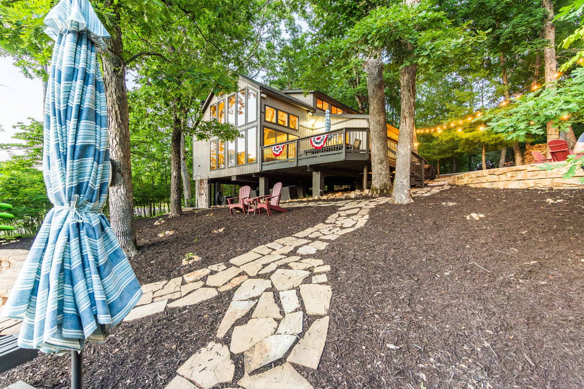 The backyard has a gentle slope