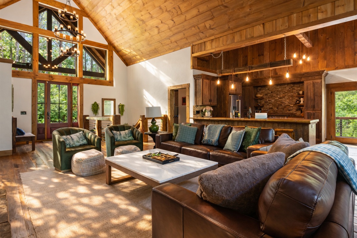 With its vaulted ceilings and warm wood accents, this living room is an inviting space to gather morning, noon, or night.