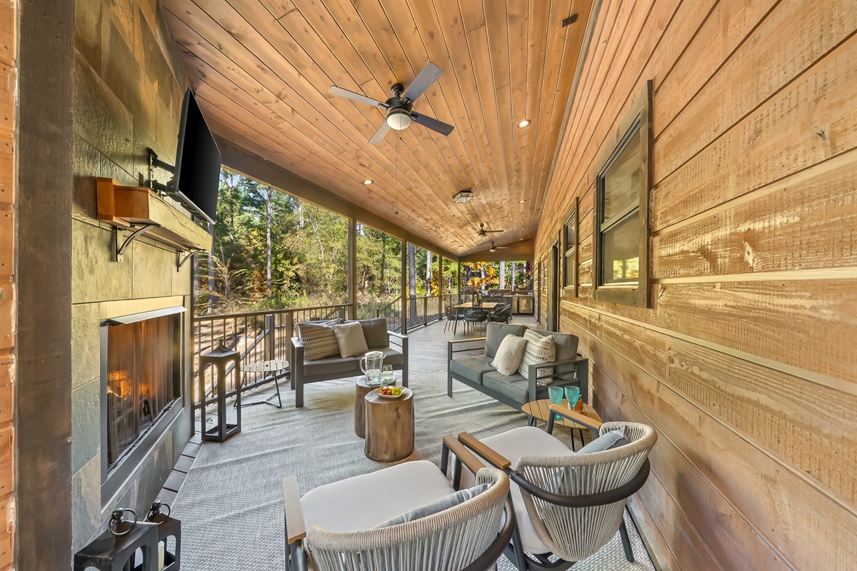 Entertainers deck thoughtfully arranged with bar, dining, and lounge zones so everyone has a perfect place to gather.