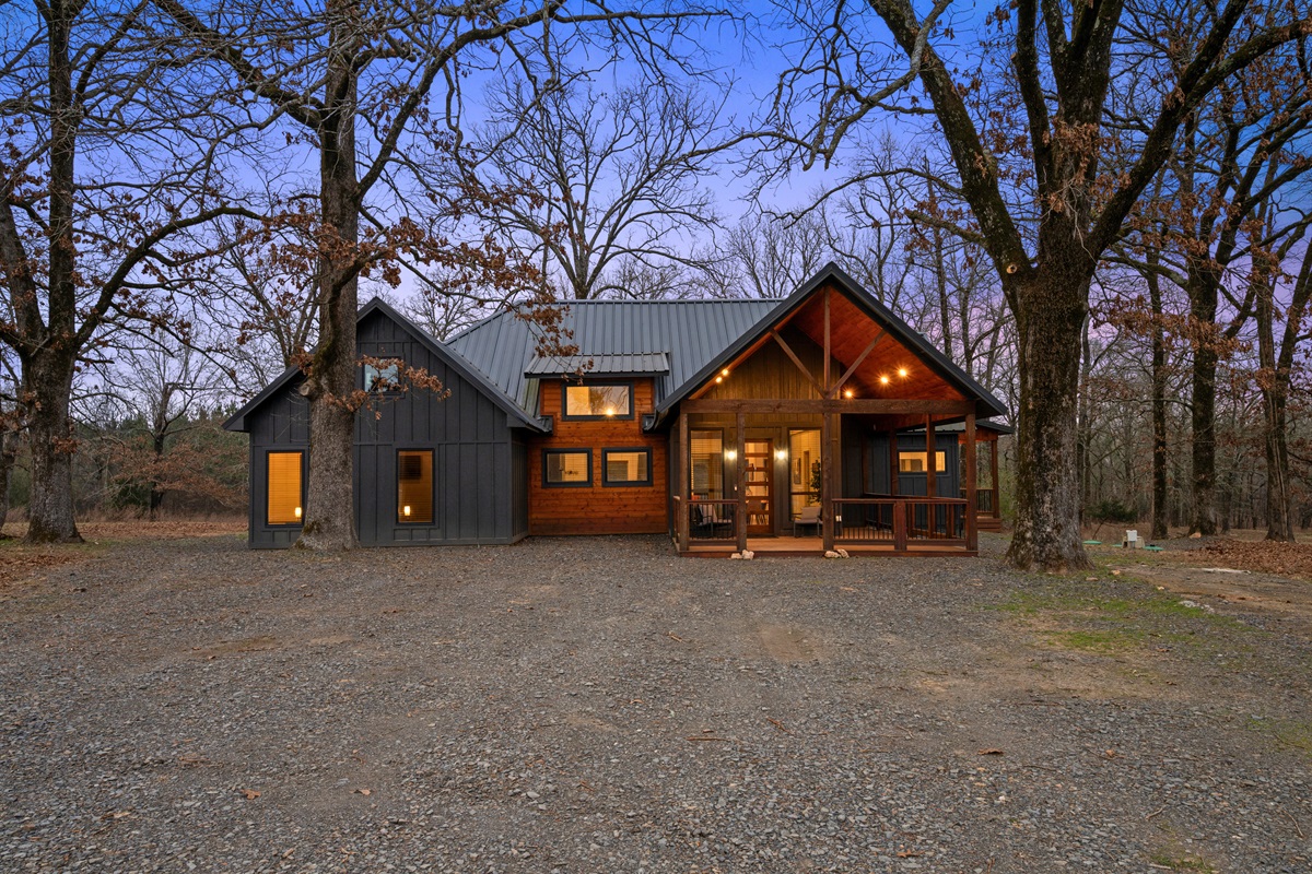 From this wide angle, you can really see how peaceful the cabin feels, sitting quietly among the trees with plenty of space around it.