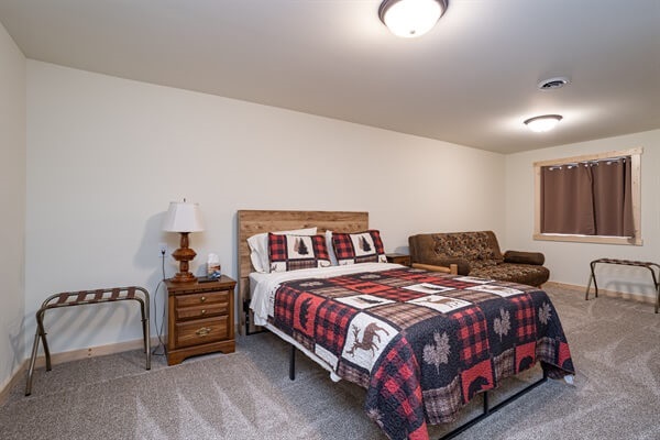 Bed 4 is our largest with a futon and extra room to set up a pack and play that we have located in the closet. There is also a small desk for work meetings. We installed extra insulation in this room to keep it extra quiet for sleeping little ones.