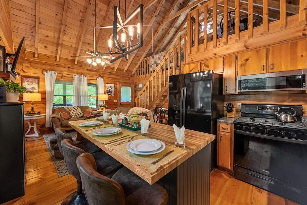 View of the kitchen island, living room and loft.