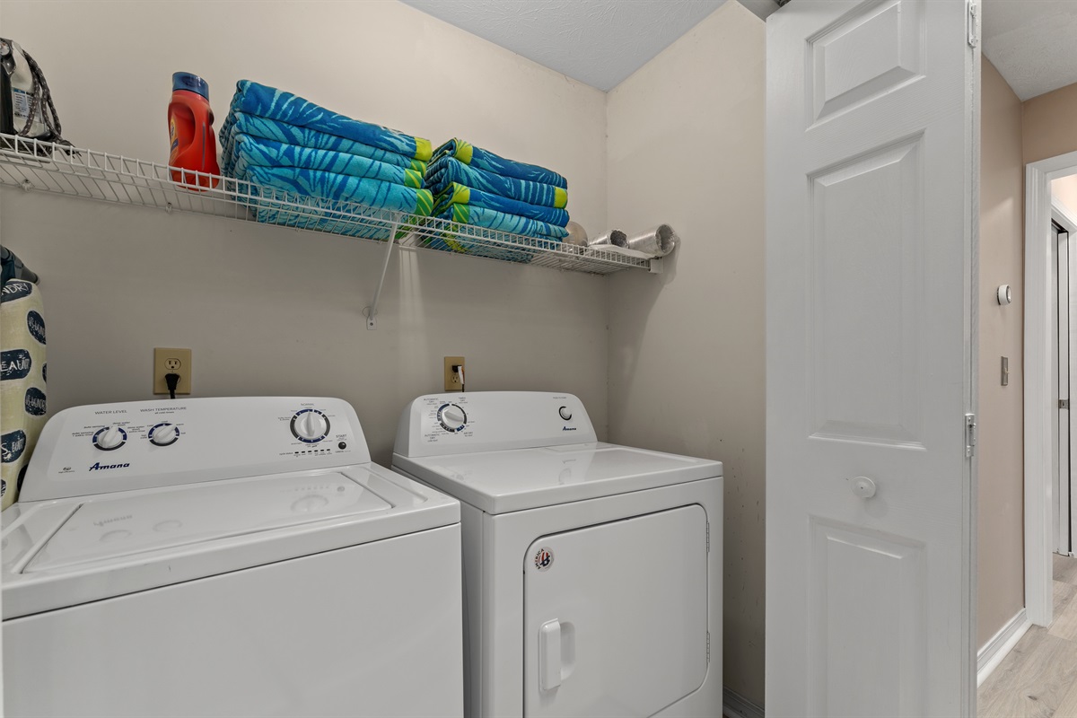 washer/dryer, ironing board, towels