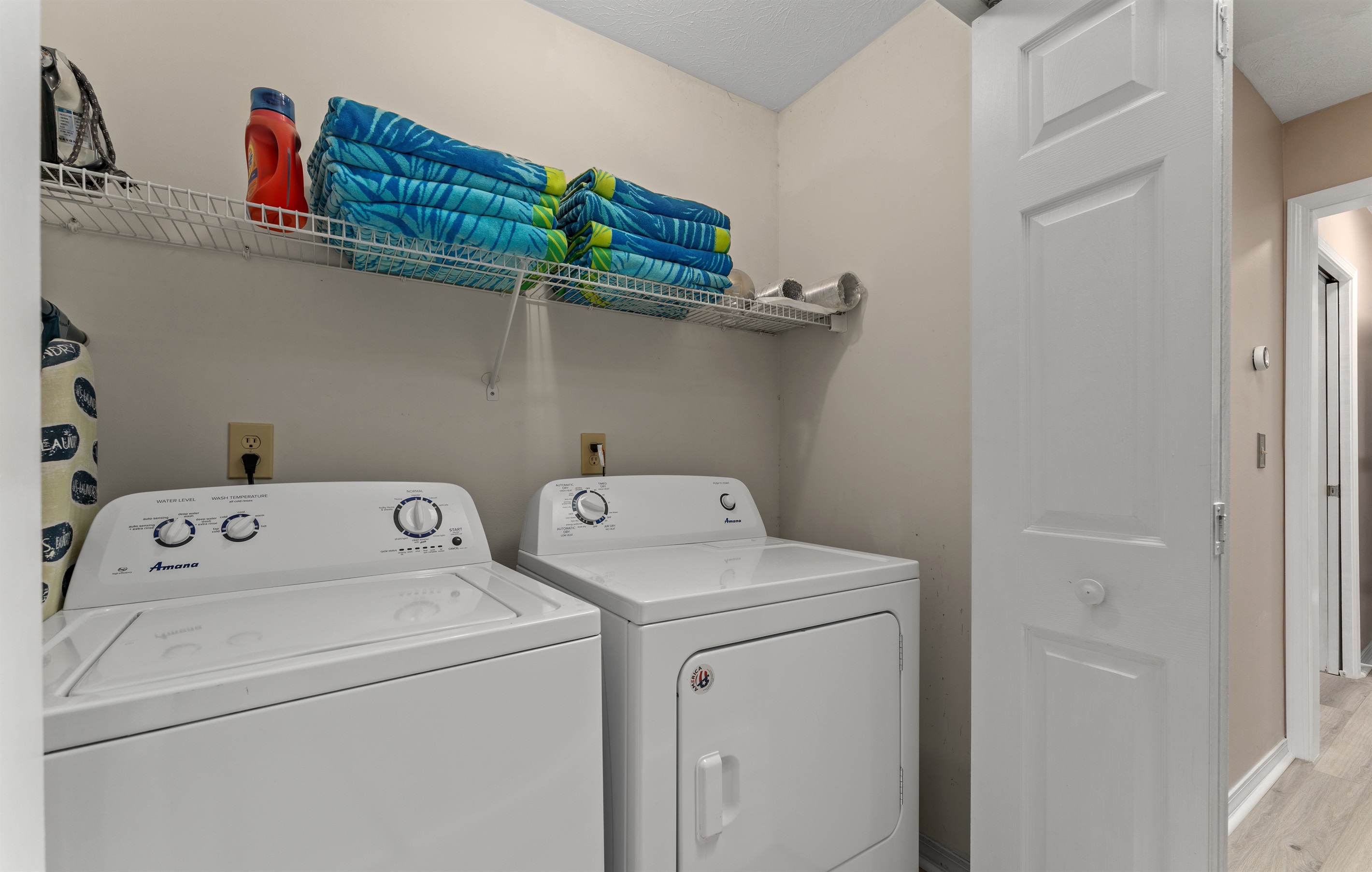 washer/dryer, ironing board, towels