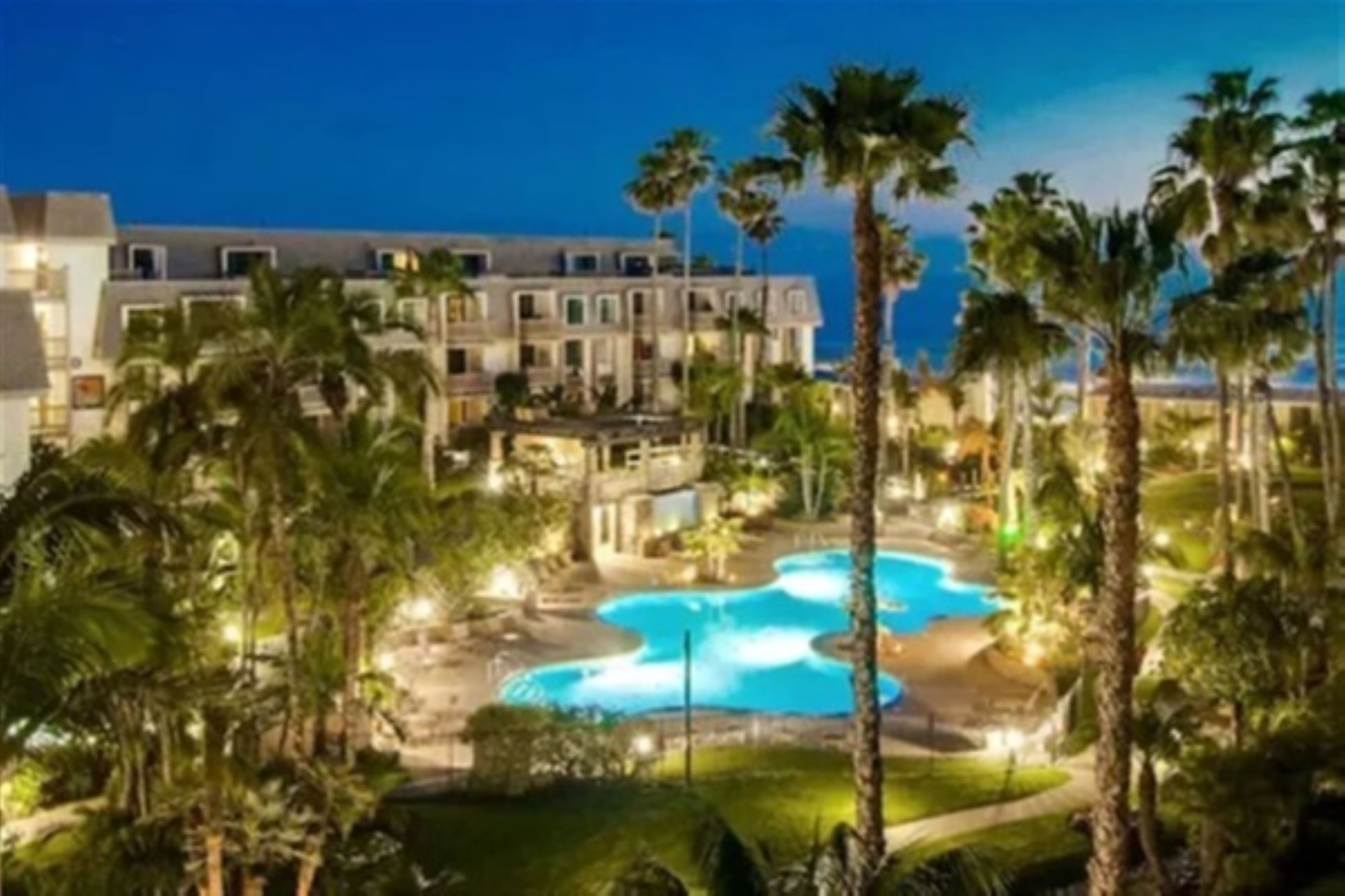 Calming pool and tropical landscaping at North Coast Village