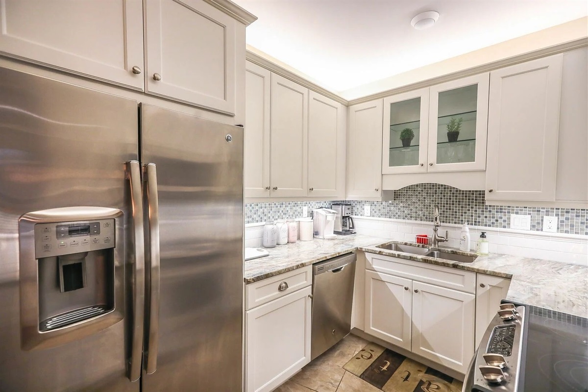Modern kitchen with stainless steel appliances and granite counters.