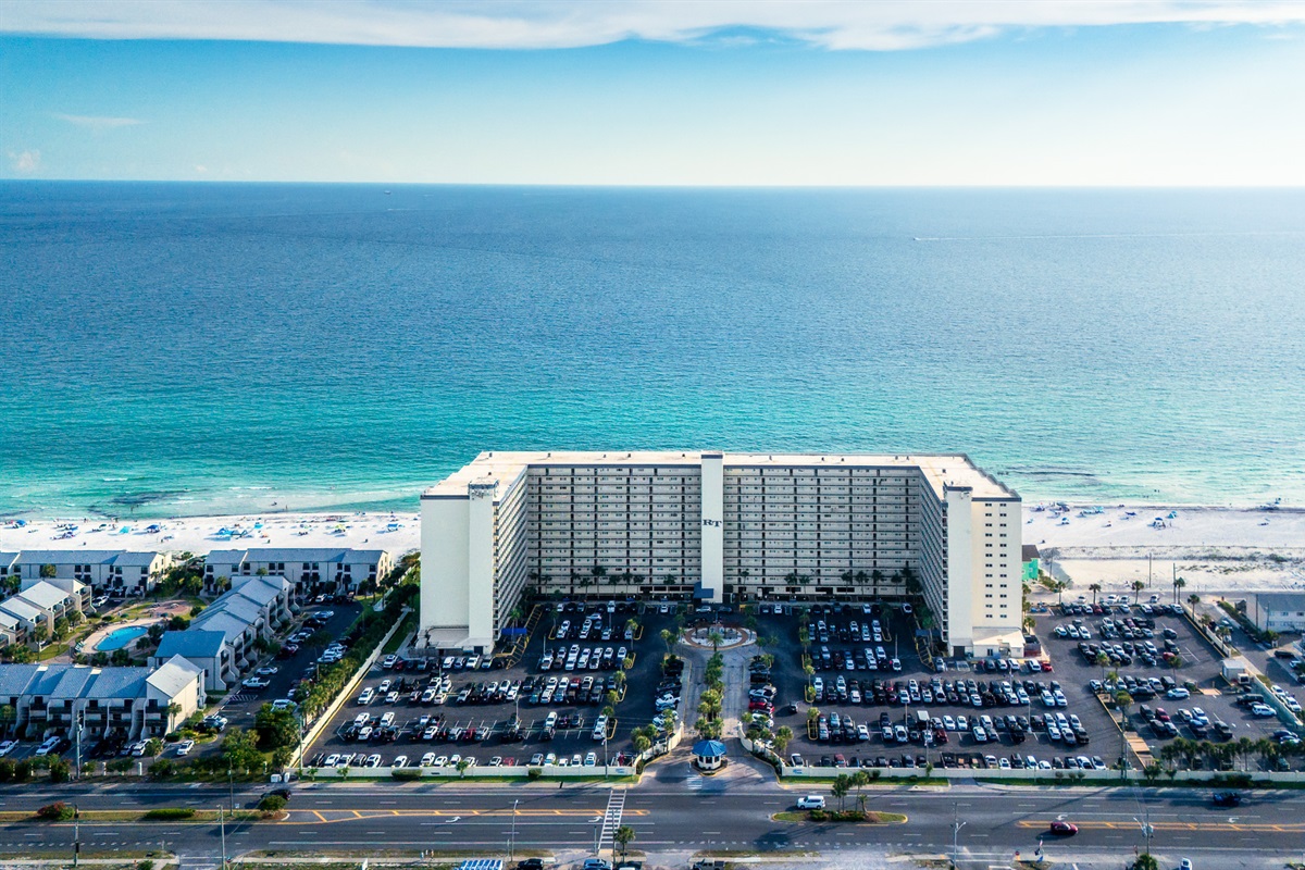 The resort rises proudly on the shoreline, giving you unmatched access to beach and water.
