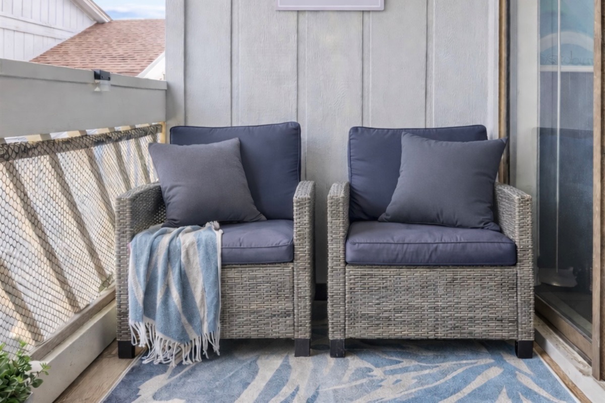 Step outside and settle into your private balcony retreat. Soft coastal tones, comfortable seating, and the gentle ocean breeze set the mood. Morning coffee, evening wine, or late-night conversations — this is your quiet little escape above it all.