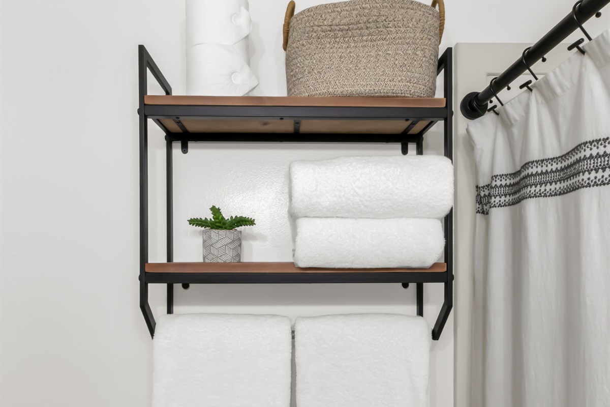 Added shelving for personal items, towels, blow dryer, and extra TP.