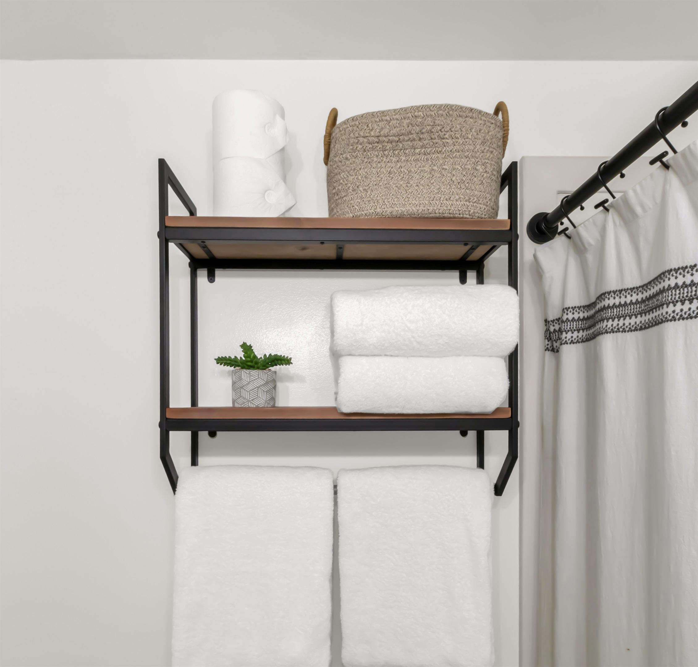 Added shelving for personal items, towels, blow dryer, and extra TP.