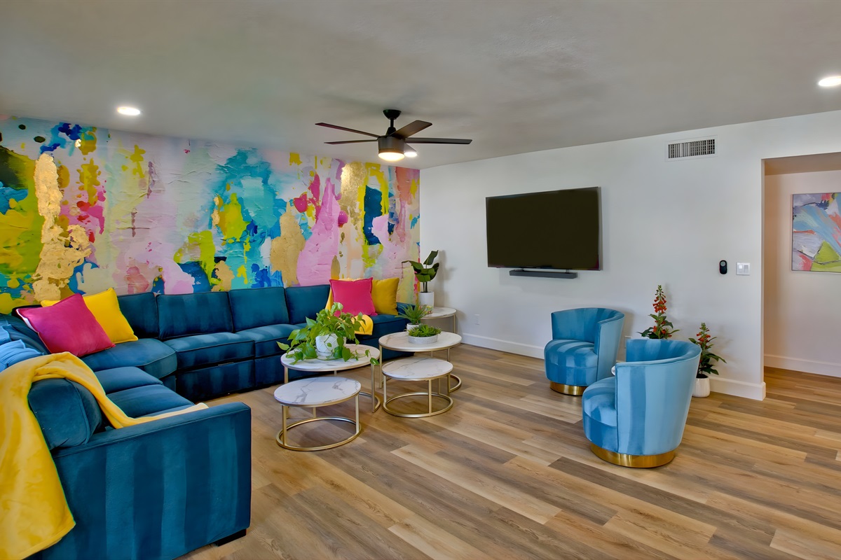 Spacious living room with colorful abstract mural | Queen Sleeper Pull-Out Sofa