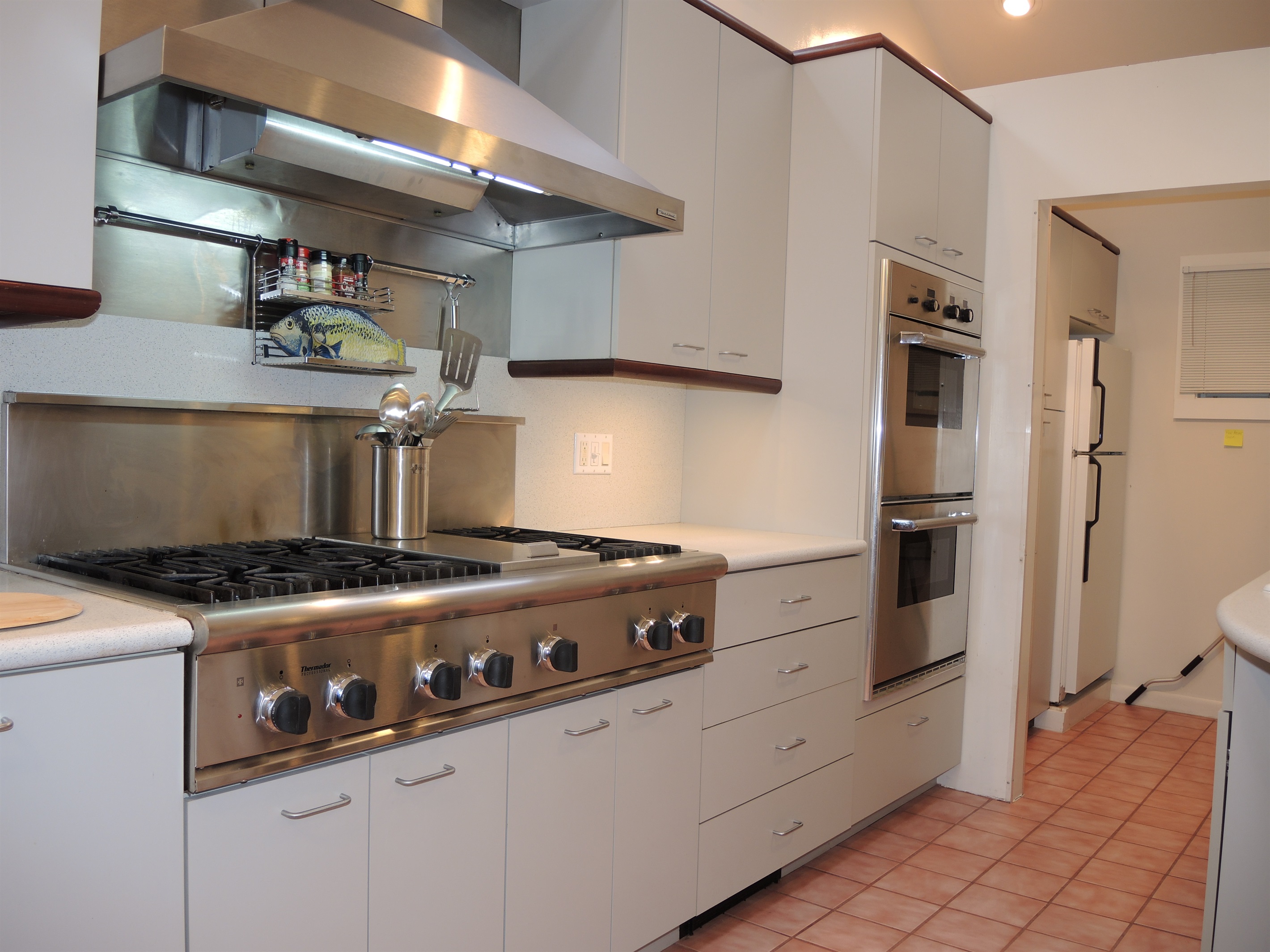 Kitchen view into pantry