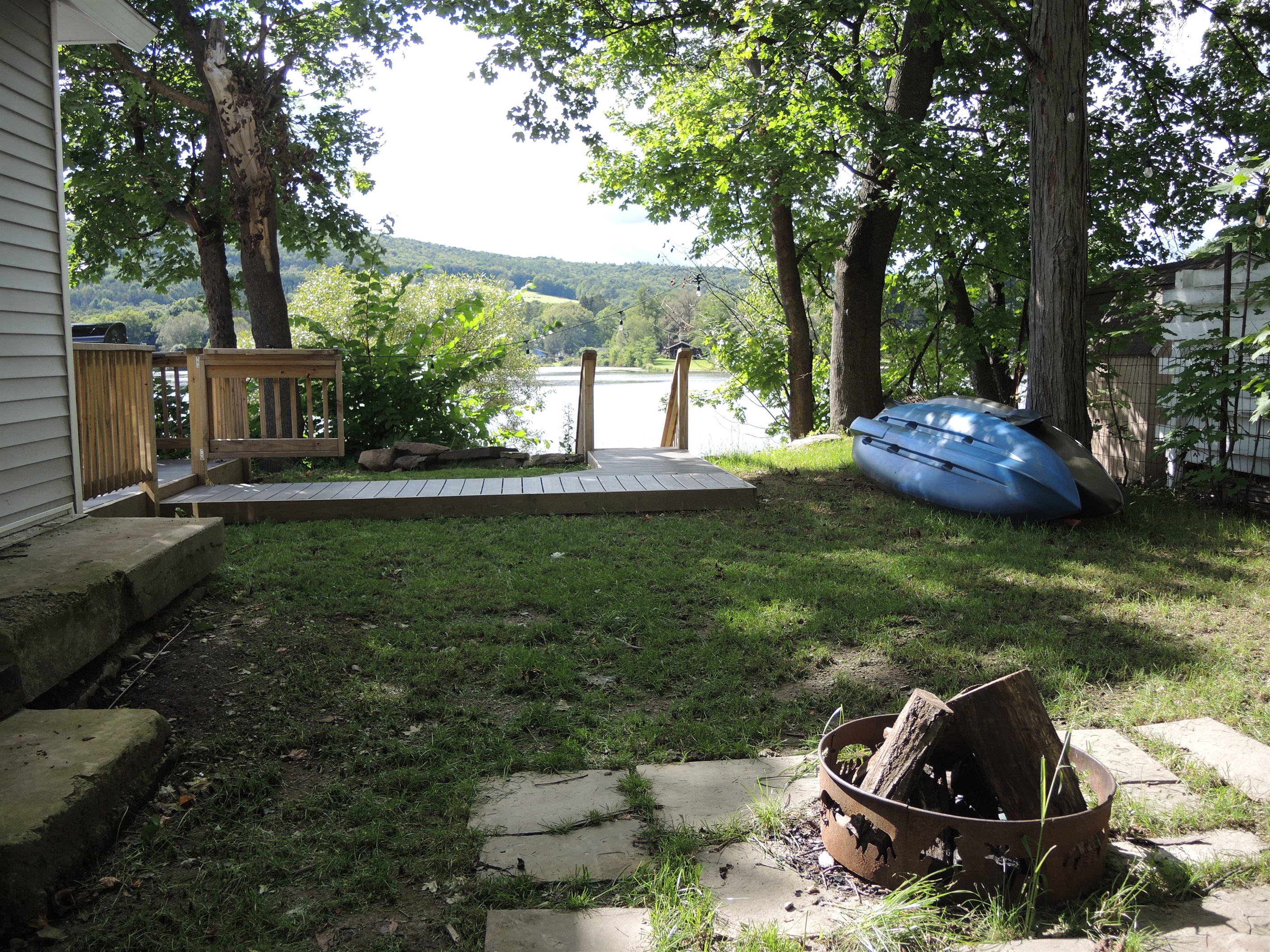 Side yard with wood burning firepit
