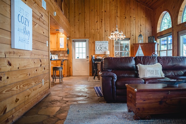 Deep leather sofas, stone floors, local timber walls give a cozy but rustic feel to lakeside getaway