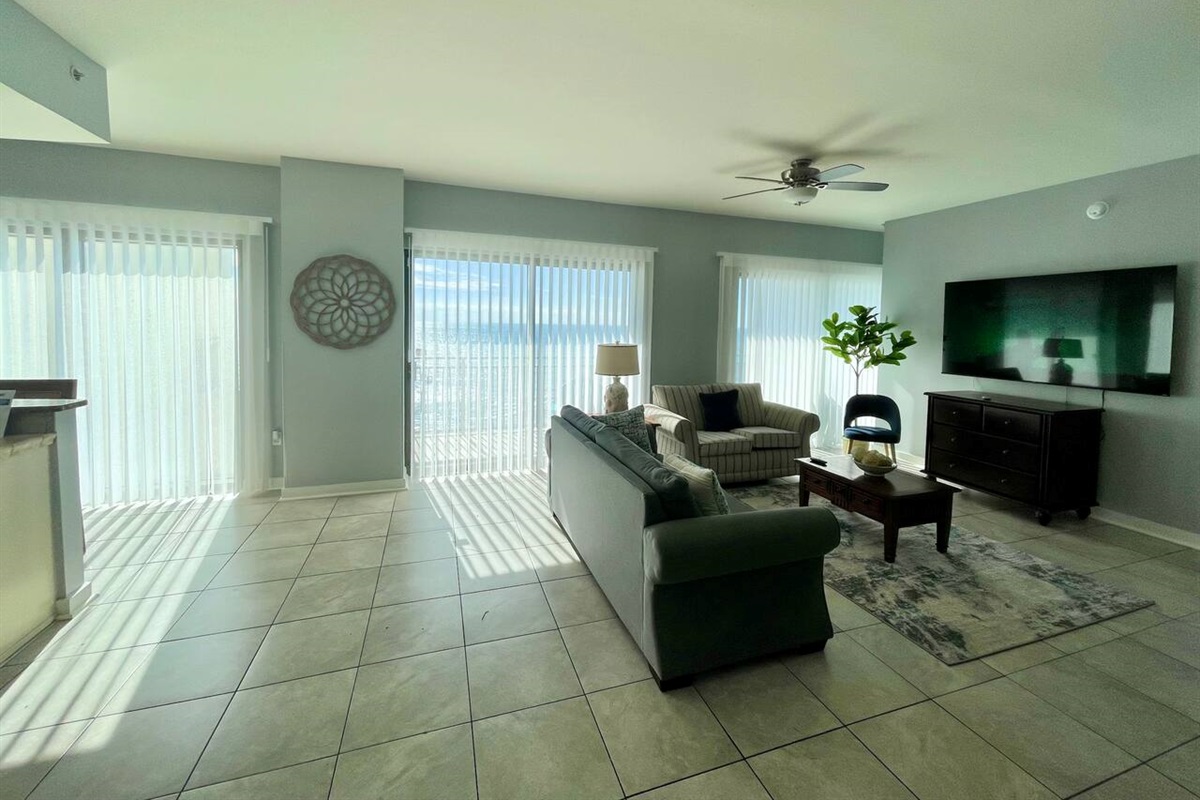 Living room with Smart blinds and  75" TV 