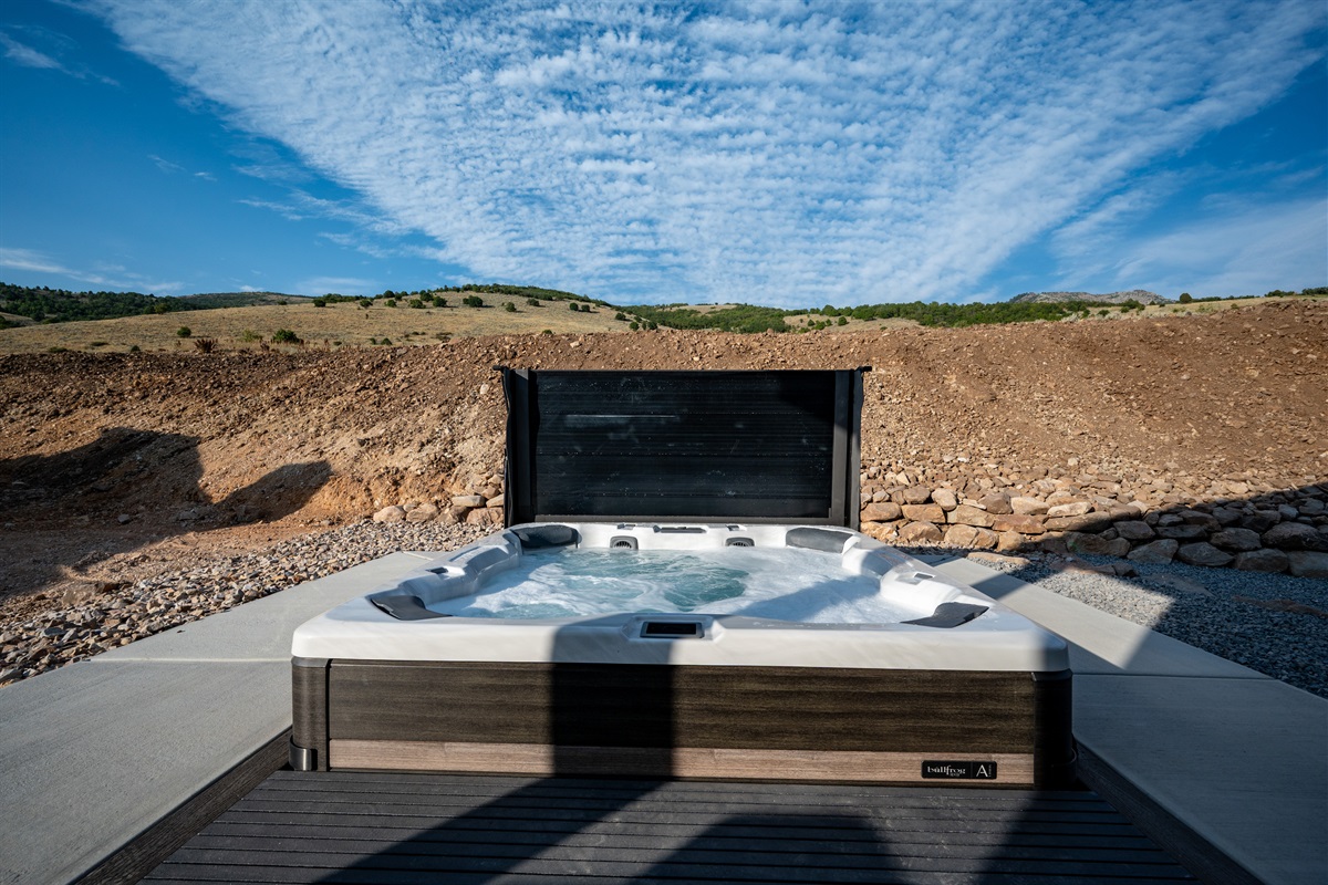 The extra-large hot tub seats eight, offering both privacy and scenic mountain views
