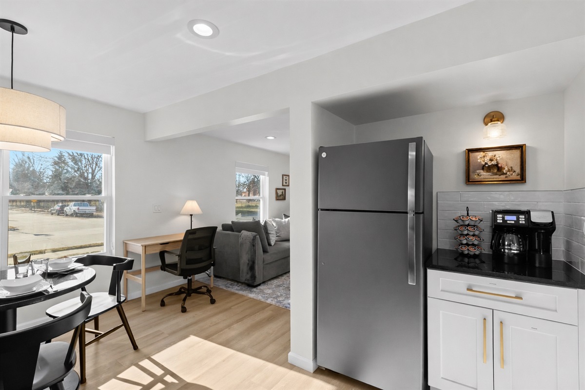 Open, airy layout connecting kitchen, dining, and living areas with abundant natural light—perfect for working, dining, and relaxing in one seamless space.