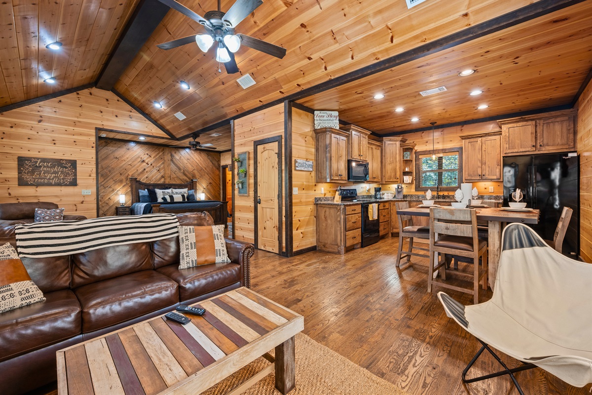 Open-concept layout with vaulted ceilings and warm lighting.