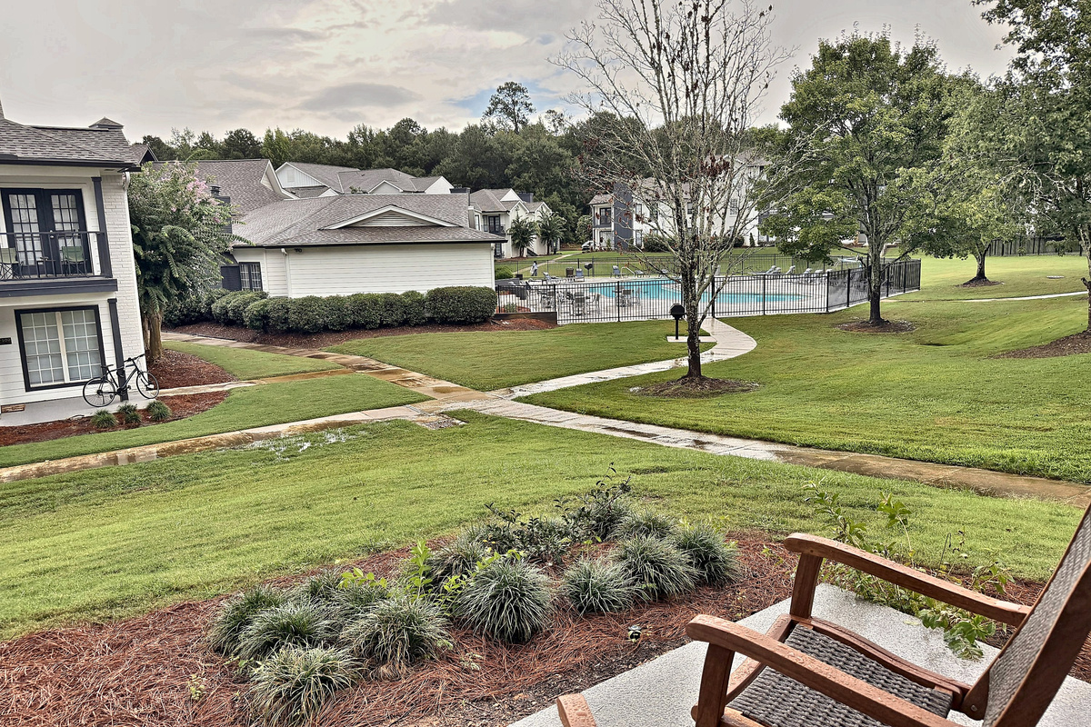 Your patio view: lawn, pool and walking path just steps from the door