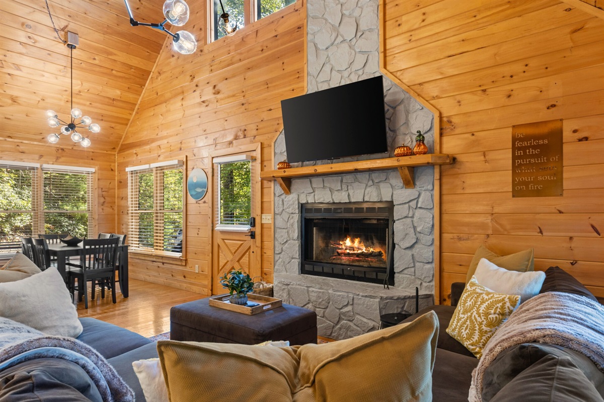 Inside, wood and warmth embrace you... the living room feels like home, only better.