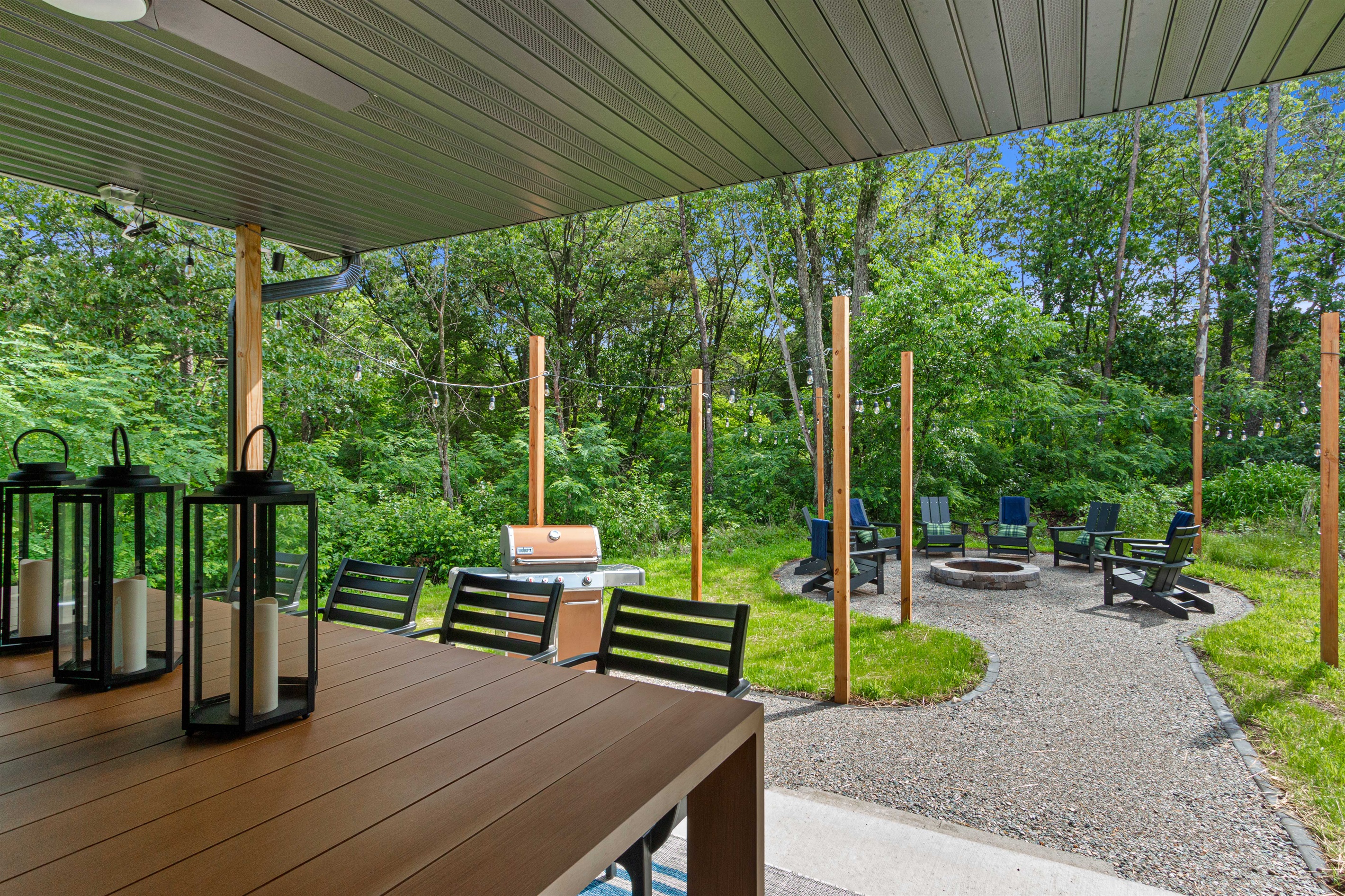 Outdoor oasis - large dining table, large propane Weber grill, and lighted firepit area