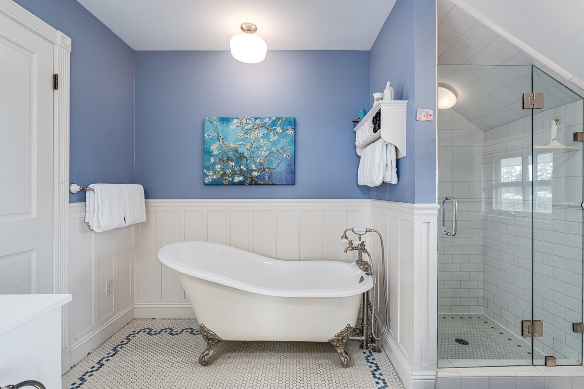 Primary bathroom with doors from hall and bedroom