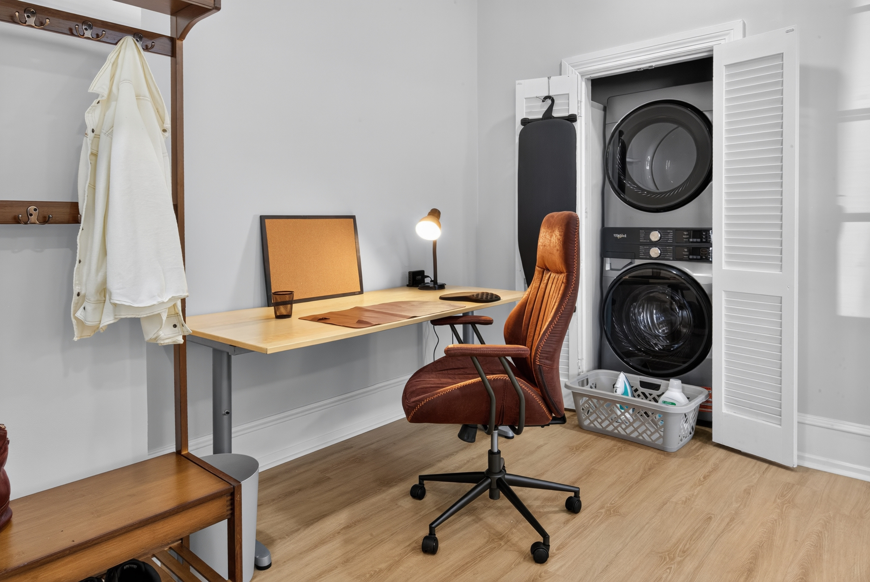 Dedicated work desk with USB charging, ergonomic chair, and high-efficiency in-unit washer/dryer closet.