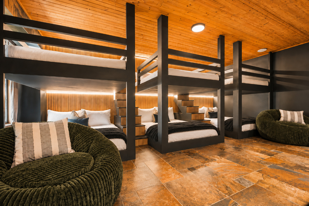 {Custom Bunk Room} A one-of-a-kind sleeping space designed for groups, featuring custom built-in queen-over-queen bunks, individual reading lights, warm wood ceilings, and a cozy modern mountain feel—perfect for kids, teens, or adults to recharge.