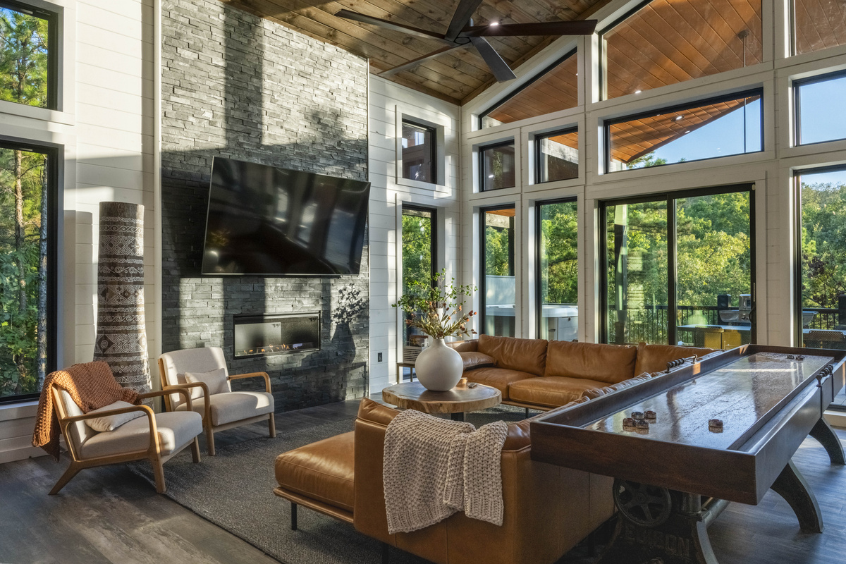 Enjoy plush seating, large windows with peaceful forest views