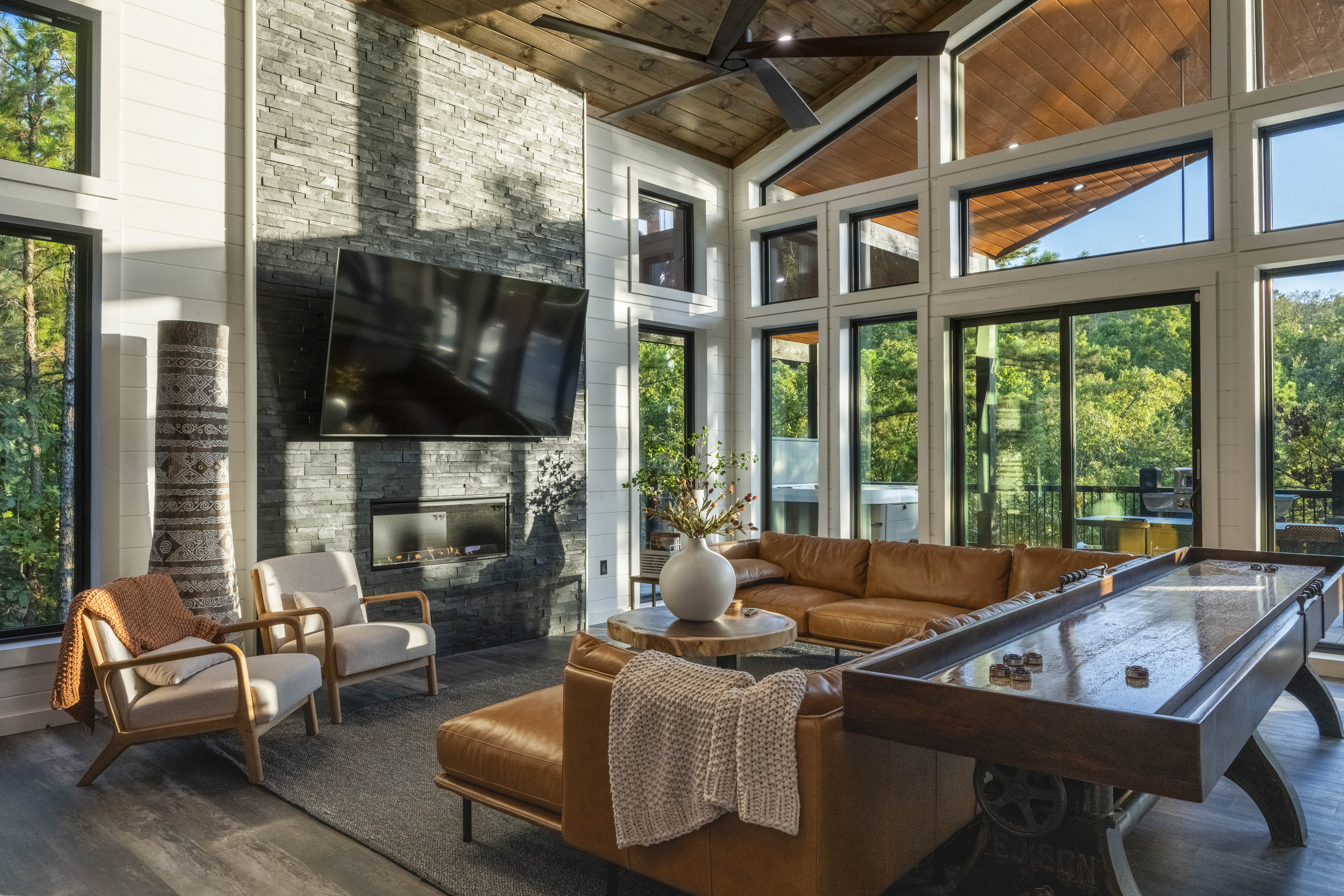 Enjoy plush seating, large windows with peaceful forest views