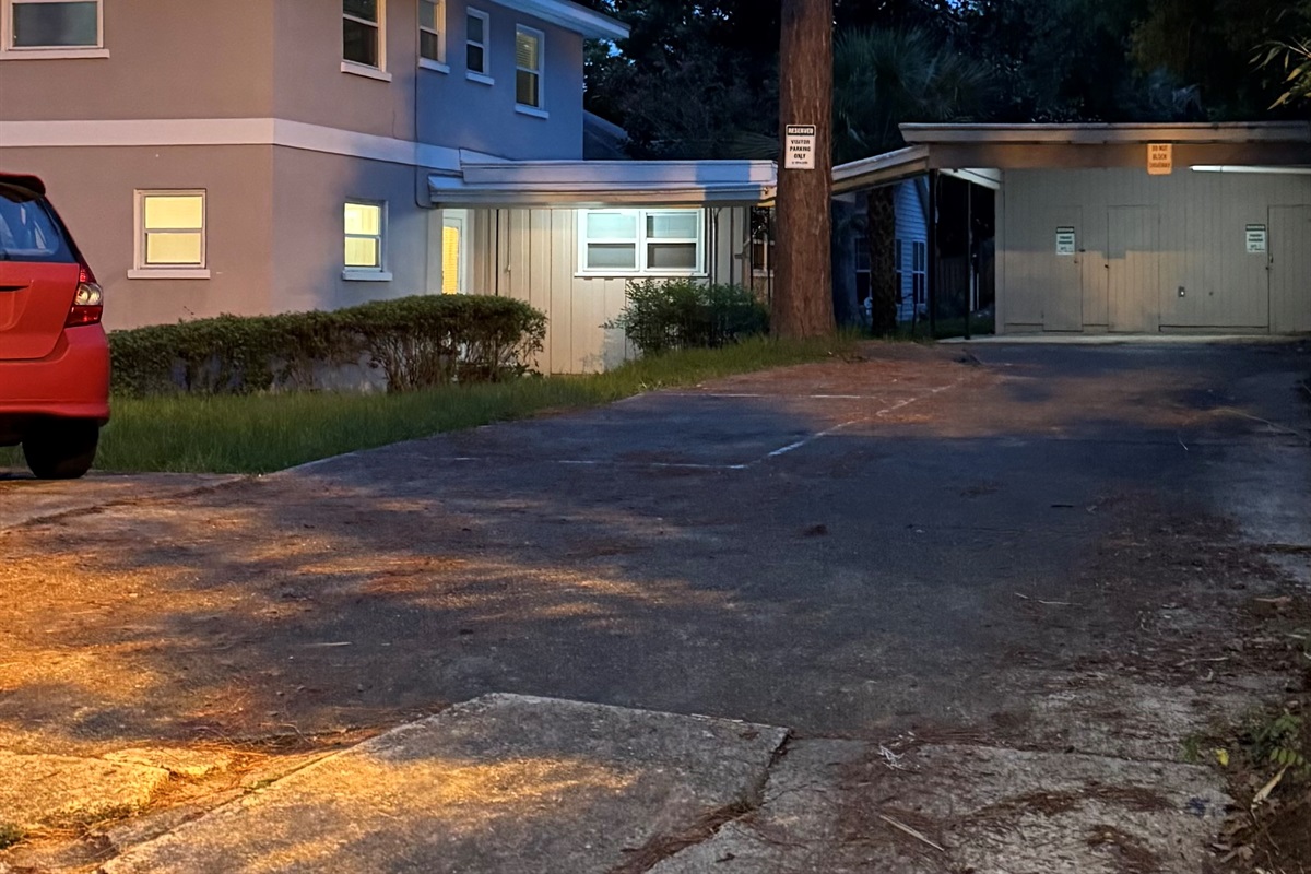 Outside of the house. The rental is the door next to the carport area with the windows on the right.