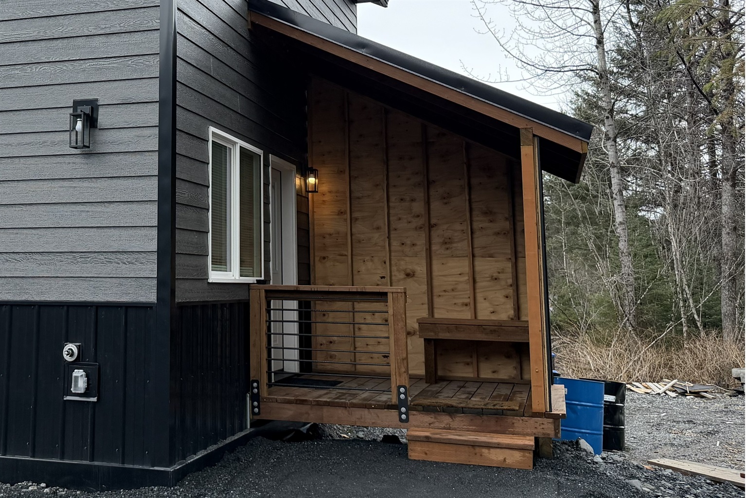 Cabin entrance with covered porch area.  There will be a freezer on the porch.
