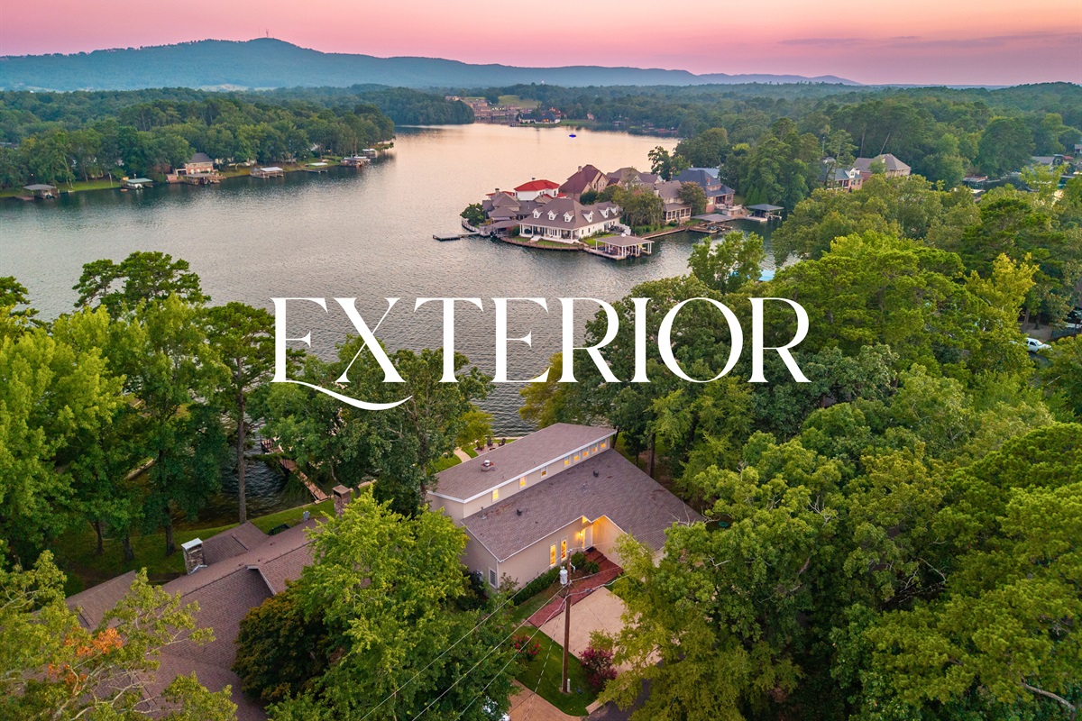 A dreamy aerial view of your lakeside getaway &mdash; tucked into nature, yet full of luxury.