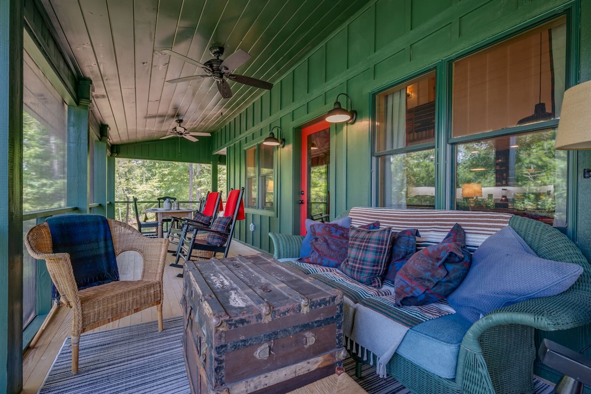 Main level deck screened in porch with plenty of seating