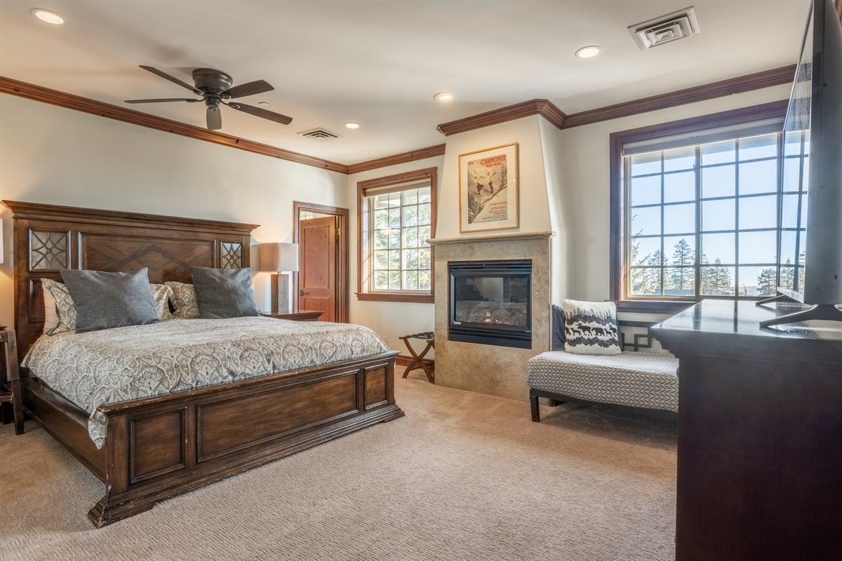 The Retreat's primary suite is a true retreat, featuring a king bed, gas fireplace, daybed, en-suite bath, and serene mountain ambiance.