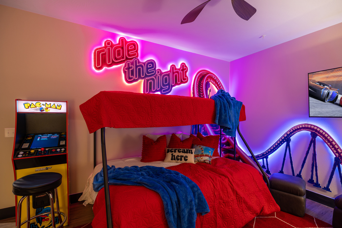 Neon on, lights low - the coaster room after dark.