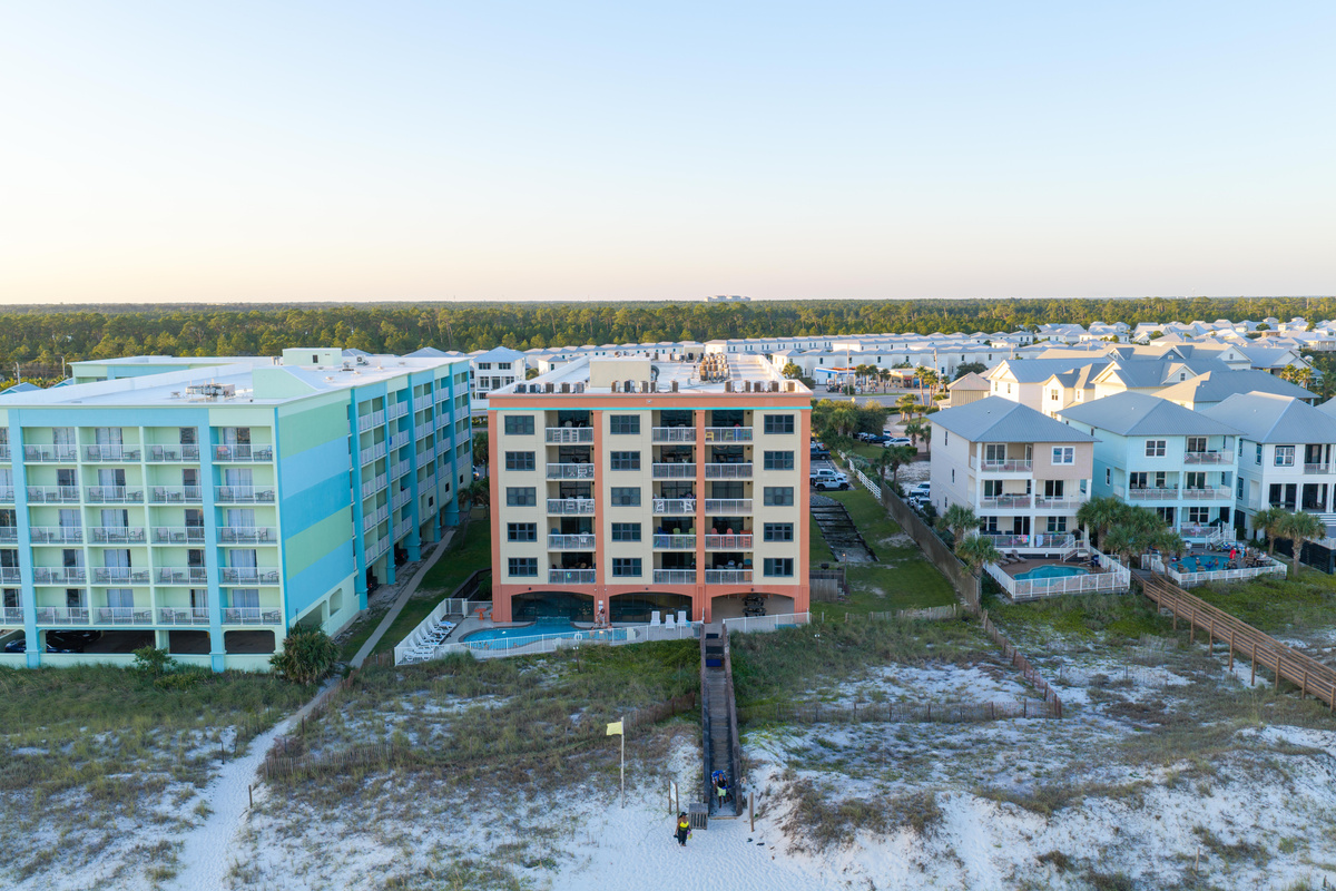 Drone view of Harbor Place condominiums from the beach in Orange Beach, AL