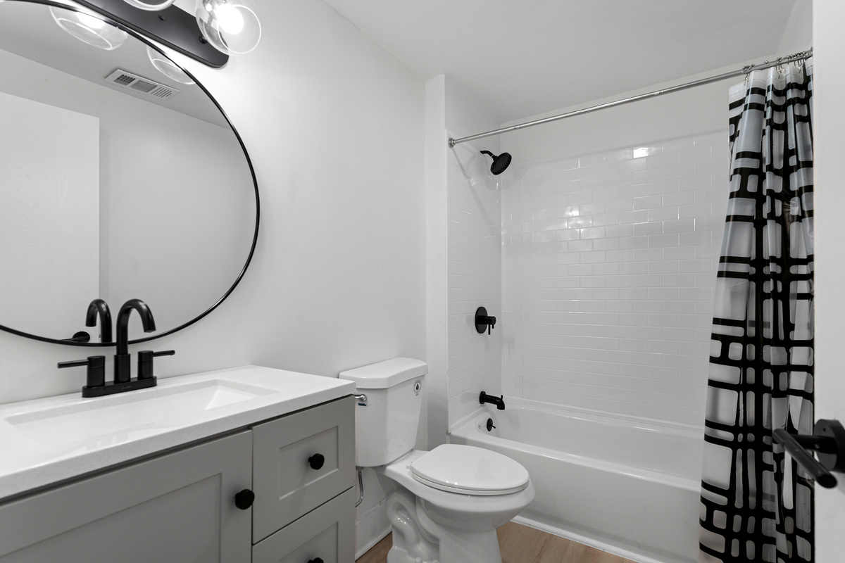Full bathroom with tub and shower combo