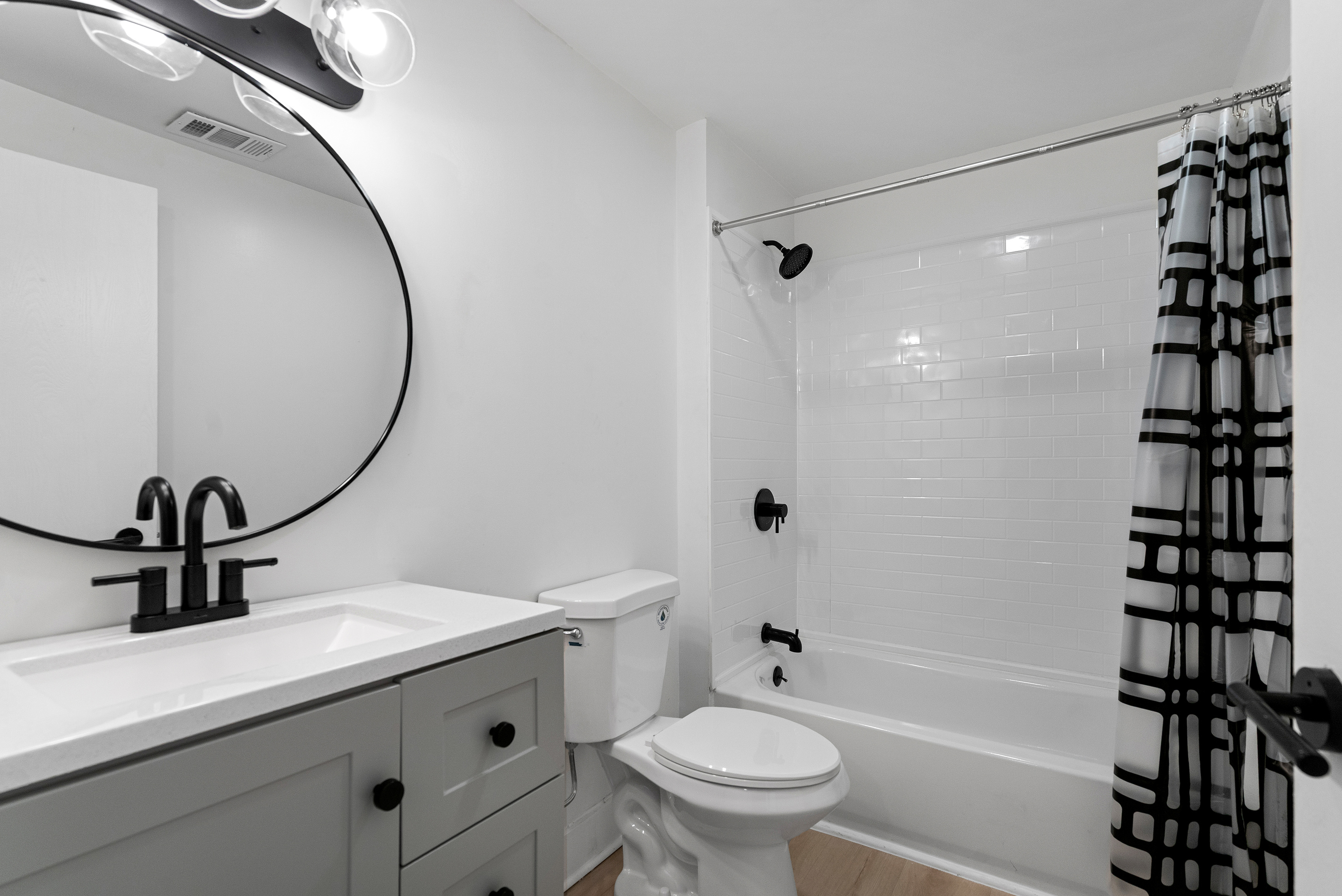 Full bathroom with tub and shower combo